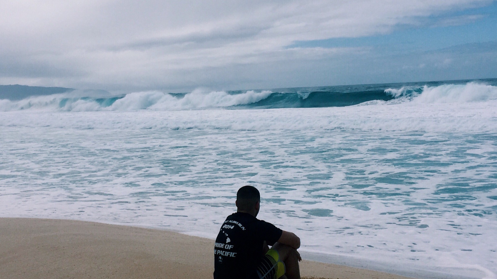 PCSing To Hawaii. Man sitting on a hawaii beach